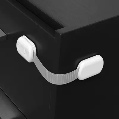 Demonstrates how to install a child safety lock on furniture to prevent accidents.
