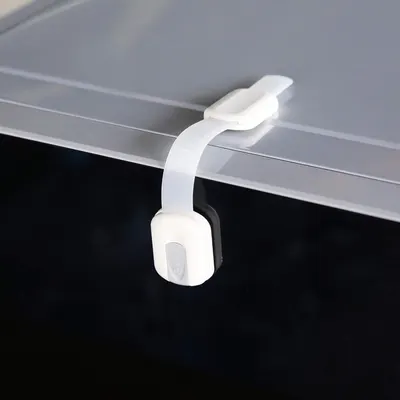 Demonstrates the product's child safety feature, showing how it securely attaches to furniture to prevent children from accessing potentially dangerous areas.