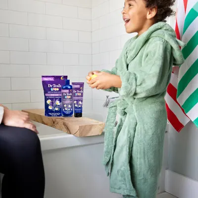 Shows the product in a real-life bath time setting to demonstrate its use and appeal to children.