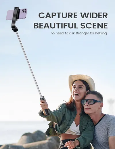 Demonstrates how the selfie stick allows users to capture wider, more scenic photos without needing help from others.