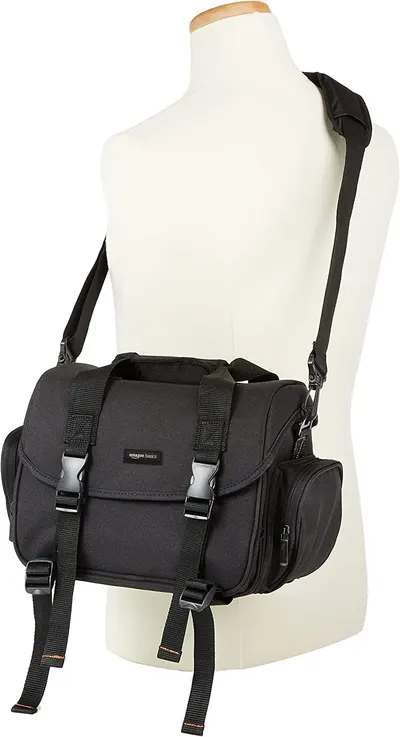 Shows the camera bag's design and carrying options to demonstrate its functionality and versatility.