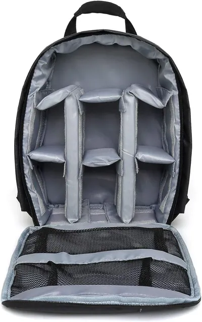 Shows the interior organization and storage capacity of the backpack, highlighting its multiple padded compartments for safely storing camera equipment or other gear.