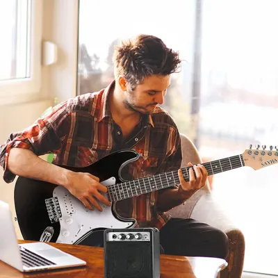 Shows the product being used in a real-world home setting, demonstrating its practicality for casual musicians.