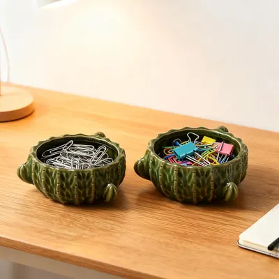 Shows how the product can be used to organize different types of office supplies like paperclips and binder clips. Demonstrates how the product can be used in a desk setting to keep small office…