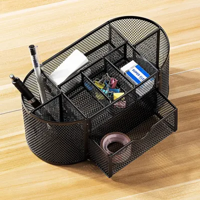 Shows the various compartments and storage options of the desk organizer, demonstrating its capacity to hold different office supplies.
