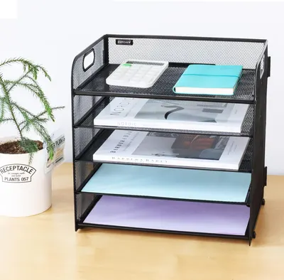 Shows the product's capacity to organize and store various documents and office supplies, demonstrating its utility for desk organization.