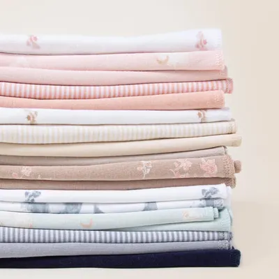 Showcases the range of fabric options available, highlighting different colors, patterns, and textures to appeal to various customer preferences.