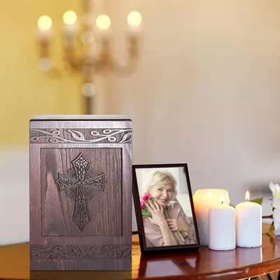 Showcases a complete memorial set including an ornate urn, photo frame, and candles to honor a loved one's memory.