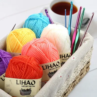 Shows the complete set of colorful yarn skeins and crochet hooks included in the product package, highlighting the variety and value for crafters.