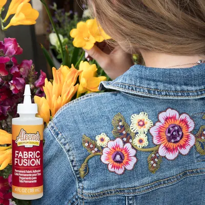 Demonstrates how the product can be used to create decorative floral designs on denim clothing, showcasing its versatility for fabric crafts.