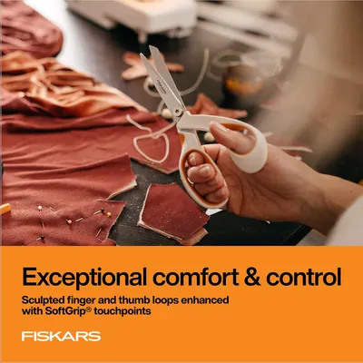 Highlights the exceptional comfort and control of the scissors through their sculpted finger and thumb loops with SoftGrip touchpoints.