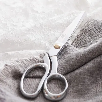 Highlights the high-quality craftsmanship of the scissors, suggesting precision and durability for sewing or crafting tasks.