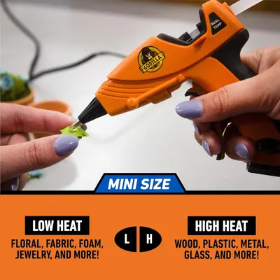 Demonstrates the compact size of the glue gun by showing it in use with small objects. Highlights the product's dual temperature settings and its ability to work on various materials, from delicate…