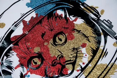 Creates a visually striking and memorable brand image using an artistic representation of a cat face with glitter textures.