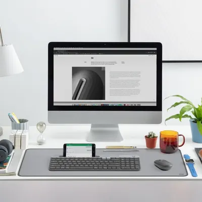Shows the product in a real-world context of a clean, organized home office desk setup to demonstrate how it integrates into a productive workspace.