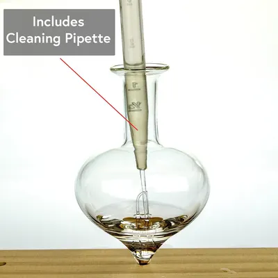 Informs the shopper that a cleaning pipette accessory is included with the product, adding value and clarifying what comes in the package.