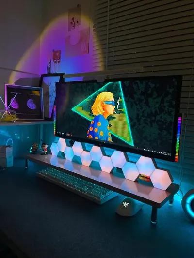 Demonstrates the product in a real-world gaming and creative environment to show its versatility and aesthetic appeal in a modern workspace setup.