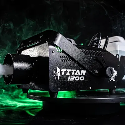 Demonstrates the product in use within a real-world atmospheric setting, showing the fog machine actively producing green-lit smoke to help shoppers visualize its performance and effect.