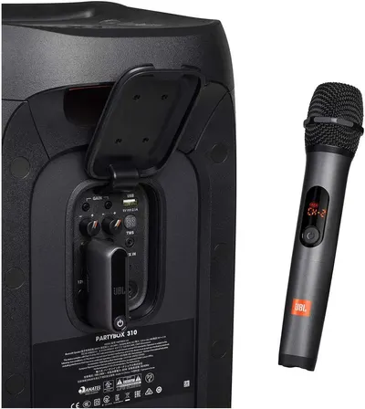 Highlights the back panel controls and features of the speaker, showing the gain knobs, USB charging port, TWS connectivity, and microphone storage compartment to help shoppers understand the…