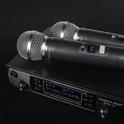 Displays the dual wireless microphone system in a professional context to help shoppers visualize the complete product setup and understand its real-world application.