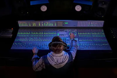 Demonstrates the product in a real-world professional studio setting to show its application in audio production and mixing contexts.