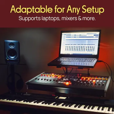 Demonstrates that the product can support various music production equipment including laptops, mixers, and keyboards in a professional studio setup.