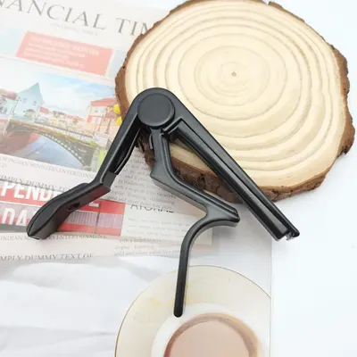 Shows the product in a natural setting with everyday items like a wood slice and newspaper to help shoppers visualize how it fits into their lifestyle.