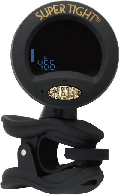 Shows the guitar tuner clipped and ready to use in a real-world setting, helping shoppers visualize how the product looks and functions when attached to an instrument.