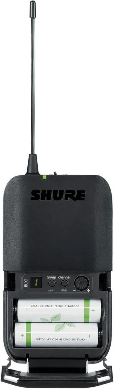 Shows the internal battery compartment and control interface of the wireless receiver to help users understand how to load batteries and operate the device.