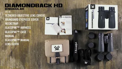 Shows everything included with the binoculars purchase to help shoppers understand the full value of the package including accessories, manuals, case, and harness system.