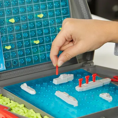 Demonstrates how to play the game by showing the hand placement and game board setup, helping shoppers understand the gameplay mechanics and ease of use. Highlights the interactive, hands-on nature…