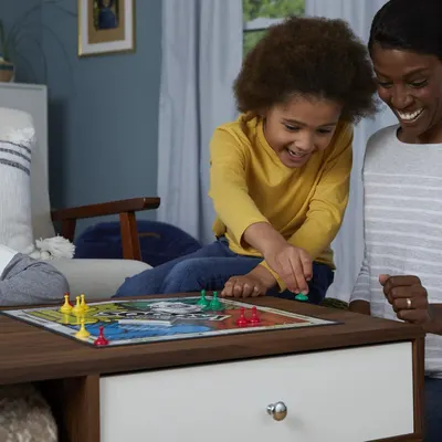 Demonstrates the product being enjoyed in a real-world home setting to help shoppers visualize the product as part of family time and everyday life.
