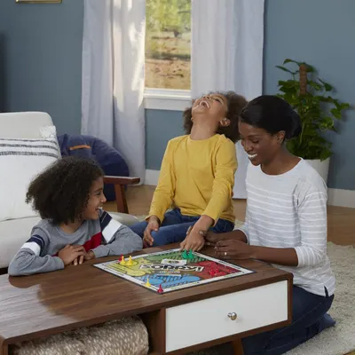 Showcases the product being enjoyed in a real-world home setting to help shoppers visualize the product in use and connect emotionally with the family-friendly experience it provides.