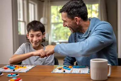Demonstrates the product being enjoyed in a real-world home setting to create emotional connection and show the product brings families together for quality time.