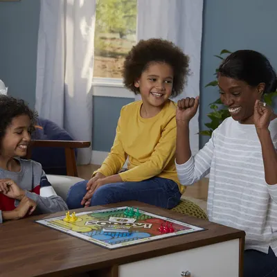 Demonstrates the product in a real-world home setting to show how it brings families together for fun and entertainment.