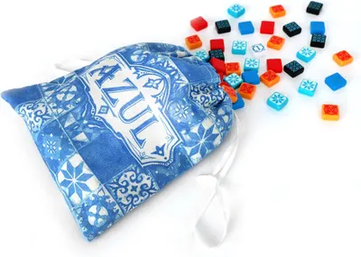 Shows everything included with the purchase—a decorative storage bag and colorful game pieces—to help shoppers understand the complete package they'll receive.