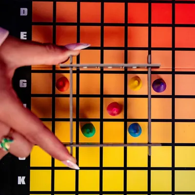 Demonstrates how to use the product by showing hands actively playing the game, helping shoppers understand the interactive gameplay mechanics and ease of use. Shows the product being used in a…