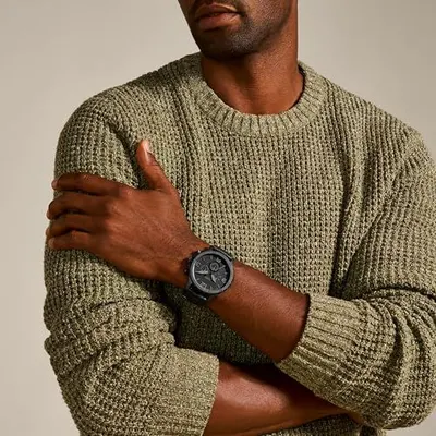 Demonstrates the watch worn in a real-world lifestyle context to help shoppers visualize how the product looks when worn, building emotional connection and style appeal.