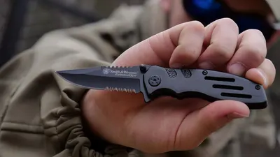 Shows the product in a real-world setting being held by a user to help shoppers visualize the knife's size, appearance, and how it looks in actual use.