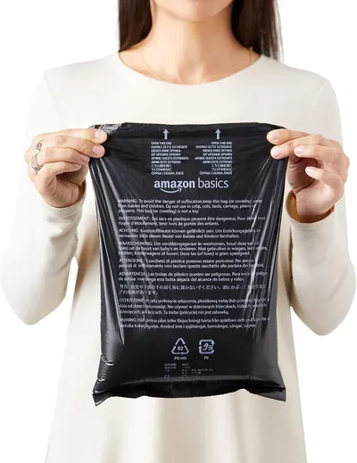 Communicates critical safety warnings about suffocation hazards in multiple languages and displays recycling information to reassure shoppers about safe usage and environmental responsibility.