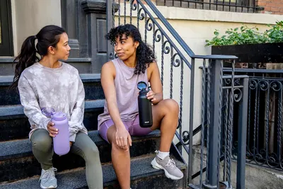 Demonstrates the product being used naturally in an everyday outdoor setting, creating relatability and showing the product as part of an active lifestyle.