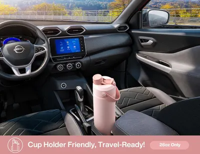 Demonstrates that the water bottle fits perfectly in a car cup holder and is designed for portability and travel convenience.
