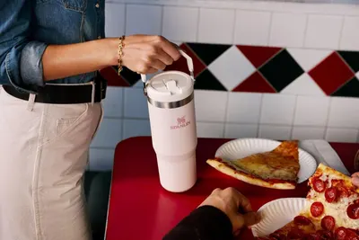 Demonstrates the product in an authentic everyday context to help shoppers visualize using the tumbler in their own life, building emotional connection and relatability.