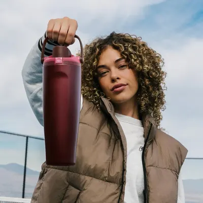 Demonstrates the product in a real-world outdoor lifestyle context to show its portability and appeal for active, on-the-go use.