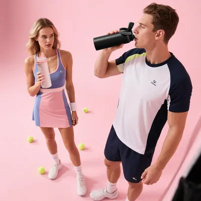 Demonstrates the product in a real-world athletic/fitness setting to help shoppers visualize using the water bottles during workouts or sports activities.