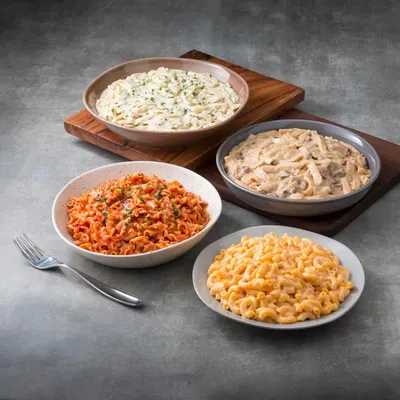 Showcases the brand's product portfolio by displaying multiple pasta varieties side-by-side, helping shoppers understand the range of flavors and options available within the product line.