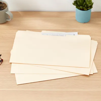 Shows the product (file folders) in a real-world desk setting to help shoppers visualize how they would use and display the folders in their own workspace.