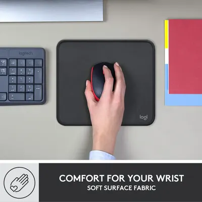 Communicates that the mouse pad provides ergonomic wrist comfort through its soft fabric surface, reassuring shoppers about comfort during extended use.