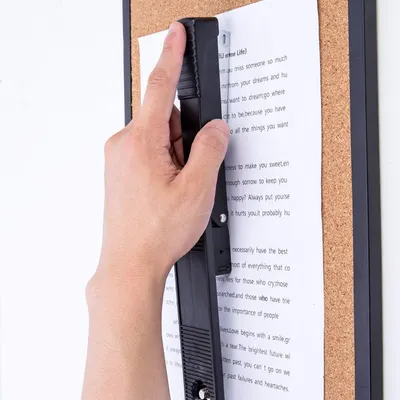 Demonstrates the product's handheld portability and ease of use for scanning documents in a real-world context, reassuring shoppers that it's simple and convenient to operate.