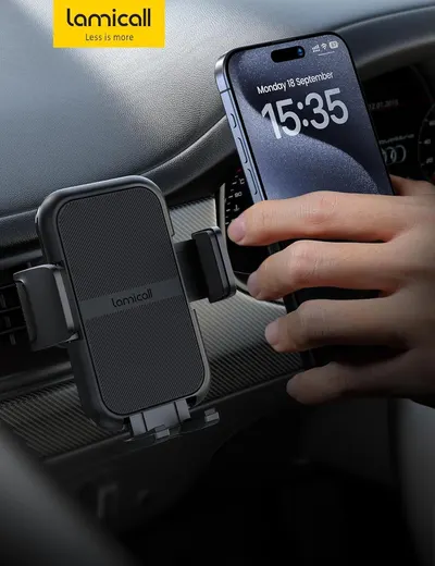 Demonstrates the product in a real-world automotive environment, showing how the phone mount holds a device securely in a car setting to help shoppers visualize practical everyday use.